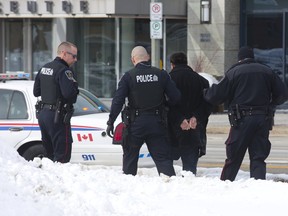 London police arrest a man near London Convention Centre. (Free Press file photo)