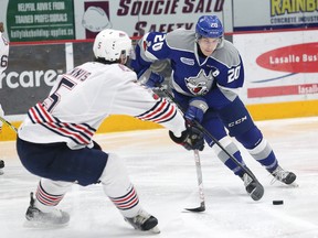 Shane Bulitka, right, of the Sudbury Wolves, and William Ennis, of the Oshawa Generals, battle for the puck during OHL action at the Sudbury Community Arena in Sudbury, Ont. on Friday February 16, 2018. John Lappa/Sudbury Star/Postmedia Network