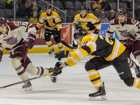 Kingston Frontenacs' Mitchell Byrne races Peterborough Petes' Pavel Gogolev to the puck heading into the Frontenacs' end during the first period of Ontario Hockey League action at the Rogers K-Rock Centre in Kingston on Friday. (Julia McKay/The Whig-Standard)