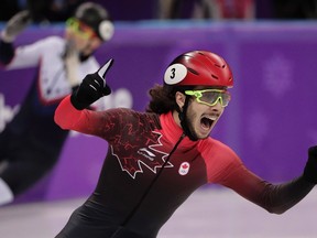 Samuel Girard, of Canada, celebrates as he crosses the finish line to win the gold medal in men's 1,000-metre short track speedskating final in the Gangneung Ice Arena at the 2018 Winter Olympics in Gangneung, South Korea.
THE CANADIAN PRESS/AP-Julie Jacobson