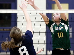 Emilie Thiffeault (10) of the St. Patrick's Fighting Irish tries to block Ursuline Lancers' Erin Horner (8) during the LKSSAA 'AAA' senior girls' volleyball final at Ursuline College Chatham in Chatham, Ont., on Friday, Feb. 16, 2018. (MARK MALONE/Postmedia Network)