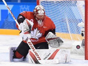 Canada goaltender Genevieve Lacasse makes a save against the United States during second period preliminary round women's hockey action at the 2018 Olympic Winter Games in Pyeongchang, South Korea, on Thursday. (THE CANADIAN PRESS/Nathan Denette)