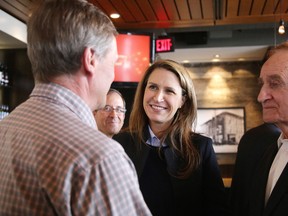 Ontario PC leadership candidate Caroline Mulroney chats with supporters, including Jim Gordon, right, during a Northern Ontario tour stop in Sudbury on Monday. (Gino Donato/Sudbury Star)