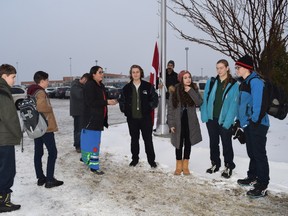 Students and staff at St. Benedict Catholic Secondary School in Sudbury raised the Canadian flag at the site of its new flag pole to commemorate National Flag Day. Supplied photo