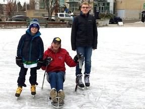 James Dunn, centre, on the ice with his brothers Nathan, left, and Morgan in front of London's Covent Garden Market. Dunn played for the London Blizzards shortly after he took up sledge hockey and years later, will play for Team Canada when they take the ice this March. Handout/Postmedia Network