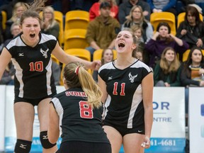 Tim Gordanier/The Whig-Standrd
Sydenham Golden Eagles Grace Finucan (10), Jocelyn Miles (8) and Robin Melnick (11) celebrate after winning the fifth and deciding set of the Kingston Area Secondary Schools Athletic Association senior girls volleyball final against the Regiopolis-Notre Dame Panthers on Monday at the Queen's University Athletics and Recreation Centre. Sydenham won the match, 3-2.