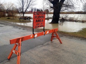 Low-lying roads near the Sydenham River were closed due to flooding on Wednesday, Feb. 21, 2018 including this area of Nelson Street north of Wallaceburg. David Gough/Postmedia Network