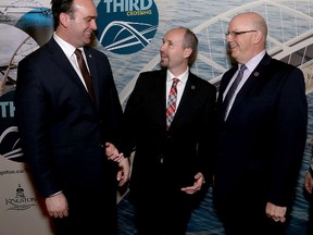 Kingston and the Islands MP Mark Gerretsen, left, Kingston Mayor Bryan Paterson and City of Kingston Chief Administrative Officer Gerard Hunt at Memorial Hall in City Hall after Gerretsen announced on Wednesday that  the federal government will contribute $60 million to Kingston's third crossing. (Ian MacAlpine/The Whig-Standard)