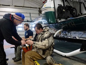 Caribou consultant Serge Couturier helps Chayse Penno pack the net in preparation for the translocation of caribou to Caribou Island from Michipicoten Island. The two were getting equipment ready in the Wilderness Helicopter hangar at Wawa airport. Couturier's assistant, Alex Gernier (back left), and Wilderness pilot, Danny Mercer (back right), were also part of the team involved in the project to preserve the threatened species.