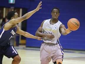 David Aromolaran of the Laurentian Voyageurs mens basketball team makes a pass during OUA playoff action against the Toronto Varsity Blues in Sudbury, Ont. on Wednesday February 21, 2018. Gino Donato/Sudbury Star/Postmedia Network