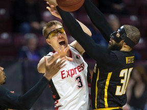 Windsor Express forward Logan Stutz gets off a pass under pressure from London Lightning forward Royce White during their National Basketball League of Canada game at the WFCU Centre in Windsor on Wednesday night.  The Express put on a charge after a slow start for a 110-100 victory, their fourth win in five games against Central-leading London this season. (DAX MELMER/Postmedia News)