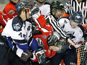 Rimouski Oceanics Sebastien Piche (7) and Windsor Spitfires Adam Henrique (14) fight during the third period of action of their preliminary Memorial Cup game at the Rimouski Coliseum in Rimouski, May 17, 2009.
Mathieu Belanger / Postmedia