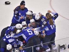 Team USA celebrates winning after a penalty shootout in the women's gold medal ice hockey match between Canada and the US during the Pyeongchang 2018 Winter Olympic Games at the Gangneung Hockey Centre in Gangneung.
ED JONES/AFP/Getty Images