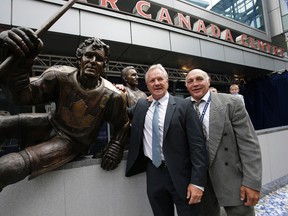Darryl Sittler and Dave 'Tiger' Williams pose for pictures with Sittler's bronzed statue. Sittler, Johnny Bower and Ted Kennedy had their statues unveiled on Legends Row at the team’s Fan Fest in Toronto on Saturday September 6, 2014. Craig Robertson/Postmedia Network file photo