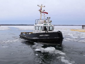The tugboat Sheri Lynn S approaches the Millhaven ferry dock in Millhaven on Thursday. Based at the Picton terminals, the new tugboat has been breaking ice this winter in support of the reconstruction of the Amherst Island ferry docks and the construction of wind turbines on the island. (Elliot Ferguson/The Whig-Standard)