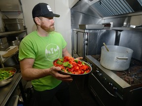 Chef Chad Hull uses fresh peppers donated from Western University in the kitchen at Ark Aid Mission on Tuesday February 20, 2018. The Middlesex London Food Policy Council, is looking for ways to get surplus fresh food to the agencies that deal with disadvantaged people. (MORRIS LAMONT, The London Free Press)
