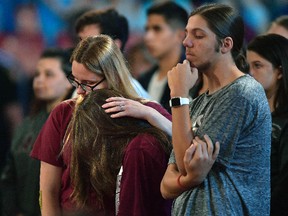 Marjory Stoneman Douglas High School students listen to sheriff Scott Israel speak before a CNN town hall broadcast last Wednesday, Feb. 21, 2018, at the BB&T Center, in Sunrise, Fla. Michael Laughlin/South Florida Sun-Sentinel via AP