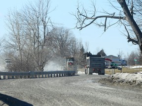 Dump trucks travel along South Shore Road on Amherst Island, Ont. on Friday, Feb. 2, 2018. Damage to that road and others on the island prompted Loyalist Township to issue a stop work order.
Elliot Ferguson/The Whig-Standard/Postmedia Network