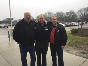 Brad Bedford, left, Paul Jenkins and Matt Sharpe celebrate the National Day of KINdness Saturday with the St. Thomas Kinsmen providing free parking at the St. Thomas-Elgin General Hospital. (Laura Broadley/Times-Journal)