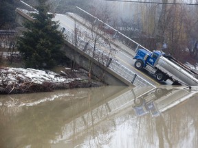 The Imperial Road bridge in Port Bruce, Ont. collapsed into Catfish Creek while Scott Barber was driving a dump truck across it on Friday February 23, 2018. Barber escaped uninjured. Photo faces northeast. Derek Ruttan/The London Free Press/Postmedia Network