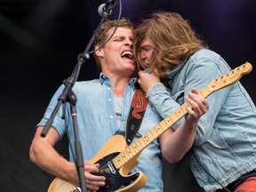 Kingstonians Jay Emmons (left) and lead singer Brett Emmons of The Glorious Sons perform at the Bluesfest in Ottawa last year. The duo returns home to perform at the Rogers K-Rock Centre on Saturday. (Postmedia Network)