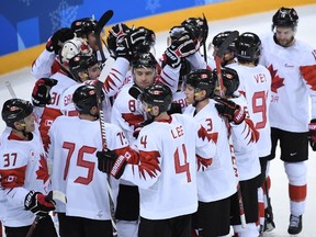 Canada's players celebrate winning the men's bronze medal ice hockey match between the Czech Republic and Canada during the Pyeongchang 2018 Winter Olympic Games at the Gangneung Hockey Centre in Gangneung.
AFP PHOTO / JUNG Yeon-JeJUNG YEON-JE/AFP/Getty Images