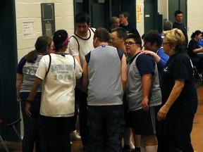 The Tillsonburg basketball team cheers one another after their game against Sarnia during the Tillsonburg Special Olympics basketball tournament in Tillsonburg, Ont. on Saturday February 24, 2018. Greg Colgan/Woodstock Sentinel-Review/Postmedia Network