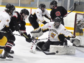 Goalie James Vink of the Mitchell Midgets stands tall to make the save during Game 4 of their OMHA ‘B’ quarter-final series with Listowel Feb. 19. Mitchell won the series in five games but dropped the semi-final opener to Parry Sound this past Saturday, 6-3. ANDY BADER/MITCHELL ADVOCATE