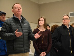 From the left, Woodlands County Mayor Jim Rennie, Grade 10 student Emma Schlosser and Alberta Forest Alliance director Ray Hilts arrive with a crowd at the Government of Alberta's Public Information Session for caribou range planning on Feb. 20 (Peter Shokeir | Whitecourt Star).