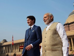 Prime Minister Justin Trudeau is greeted by Indian Prime Minister Narendra Modi as he arrives at the Presidential Palace in New Delhi, India. THE CANADIAN PRESS