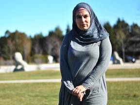 Jolly Bimbachi, a former Chatham resident who was held captive in Syria after attempting to take her two sons from Lebanon to Turkey, is shown in Kingston Park in Chatham on Monday. Her ex-husband had taken their two sons on a trip to Lebanon and never returned to Canada. Bimbachi, who has moved to Ottawa, is calling on the Canadian and Lebanese governments to come to an agreement regarding international parental abductions. Tom Morrison/Chatham This Week