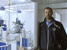 Paul Luimes, a livestock nutrition college research professor at the Ridgetown Campus of the University of Guelph, speaks about the farrowing room while providing a tour of the campus' new swine barn on Feb. 21. Tom Morrison/Chatham This Week