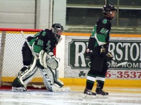 Goaltender Justin McArthur looks around Irish defenceman Jakob Neubauer in the second period of Lucan’s 7-3 loss to the Port Stanley Sailors on Sept. 20. Neubauer, the third year Irish defenceman expects to return to the team in the fall. (William Proulx/Exeter Lakeshore Times-Advance)