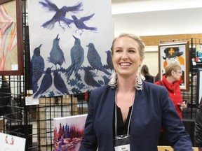 Kate Kennedy pictured with her acrylic canvas painting 'Jazz Hands.' Kate graduated from Emily Carr University in Vancouver and displayed four paintings at the show for her fourth year showing.