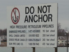 A sign near Corunna, south of Sarnia, Ont., marks where several pipelines cross the St. Clair River between Michigan to Ontario. Enbridge is planning to replace its Line 5 pipeline crossing beneath the river in late 2019 or early 2020. (File photo/Sarnia Observer/Postmedia Network)