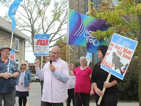 Warren (Smokey) Thomas, centre, president of the Ontario Public Service Employees Union, speaks with picketers last October outside the Elgin County branch of the Canadian Mental Health Association. The South West Local Health Integration Network has recently launched an investigation into CMHA Elgin’s compliance with its contractual agreement with the LHIN. (File photo)