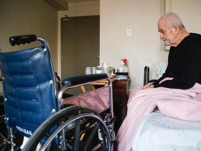 Luke Hendry/The Intelligencer
Neil McNeil, 75, sits on his bed Tuesday 2018 in a west-end bachelor apartment in Belleville he's rented for much of the last year. Tenants have been given notices to leave. "This'll be the eight time I've been moved in two years," said McNeil, who is among the tenants who moved to the building after their last residence, the Bel Marine complex, closed in February 2017.
