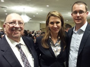 Ontario Tory leadership hopeful Caroline Mulroney is flanked by Sarnia-Lambton MPP Bob Bailey, left, and Monte McNaughton, MPP for Lambton-Kent-Middlesex, during a visit Tuesday evening to London?s Lamplighter Inn. (Dan Brown/The London Free Press)
