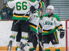 Amherstview Jets defenceman Matt Bruinsma (66) leaps into the arms of teammate Joey Mayer, who had just scored Amherstview's third goal of the game, while Zach Maciel, right, who assisted on the play, prepares to join the celebration. Amherstview won the Provincial Junior Hockey League game, 7-5, to take a 3-1 lead in the Tod Division best-of-seven semifinal. (Tim Gordanier/The Whig-Standard/Postmedia Network)