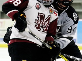 Chatham Maroons' Josh Supryka (18) battles LaSalle Vipers' Hayden Johnston (94) in the third period at Chatham Memorial Arena in Chatham, Ont., on Sunday, Oct. 22, 2017. (MARK MALONE/Chatham Daily News/Postmedia Network)