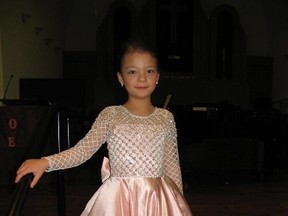 Jack Evans/For The Intelligencer
Six-year-old Isabella Guan stands on the stage of St. Matthew’s Church to sing as part of Quinte Cocktail.