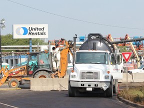 Crews are shown in this file photo at work on a Sun-Canadian pipeline at the corner of Vidal Street and Churchill Road in Sarnia that ruptured in September 2013 spilling approximately 35,000 litres of diesel fuel. In February, a provincial regulator allowed the company to return the pipeline to full operation. (FILE PHOTO/ THE OBSERVER)