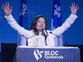 Newly acclaimed Bloc Quebecois leader Martine Ouellet salutes supporters during a rally Saturday, March 18, 2017 in Montreal. THE CANADIAN PRESS/Paul Chiasson