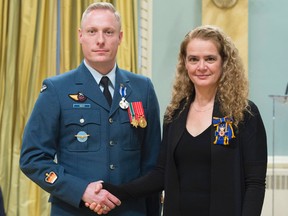 Gov. Gen. Julie Payette presents the Meritorious Service Medal (Military Division) to  Warrant Officer Nicolaas Soulis during a ceremony on Wednesday at Rideau Hall in Ottawa. (Photo by Sgt. Johanie Maheu/Rideau Hall)