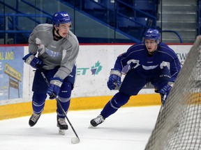 Sudbury Wolves forward Blake Murray, left, and defenceman Peter Stratis take part in a drill at Sudbury Community Arena on Wednesday, february 28, 2018. Gino Donato/The Sudbury Star/Postmedia Network
