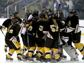 The La Salle Black Knights celebrate their win in the  Kingston Area Secondary School Athletic Association girls hockey final at the Invista Centre on Wednesday. LaSalle won 2-0 on a third period goal by Abby Howland and empty net goal by Mia Larsen-King.  (Ian MacAlpine/The Whig-Standard)