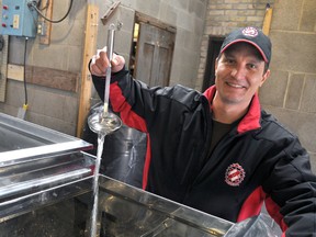 Darryl Van Moorsel, a volunteer sap boiler at Kinsmen Fanshawe Sugar Bush, recently fired up the evaporator for the first time this season. (CHRIS MONTANINI, The Londoner)
