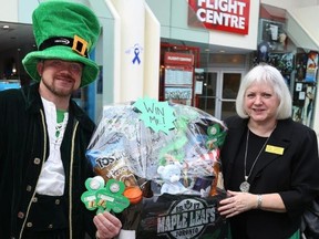TIM MEEKS/THE INTELLIGENCER
Leprechaun Matthew Bewsky and Gleaners Food Bank operations director Susanne Quinlan were on hand to launch the 2018 Shamrocks on the Wall campaign. Last year the fundraising campaign raised $15,000 for the food bank.