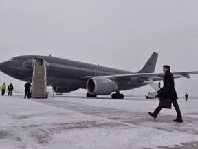 In this file photo, Canadian Prime Minister Justin Trudeau walks across a snow covered tarmac towards his plane as he departs Ottawa for Davos, Switzerland for the annual World Economic Forum on Monday, January 22, 2018. Paul Chiasson / THE CANADIAN PRESS