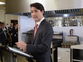 Prime Minister Justin Trudeau speaks at Cuisine-Atout, a Montreal-based catering service that employs people who have not completed their secondary education, in Montreal on Thursday March 1, 2018. THE CANADIAN PRESS/Ryan Remiorz